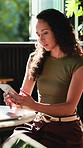 Phone, laptop and woman in cafe with remote work for email feedback on creative project with research. Computer, cellphone and editor with update for online article in coffee shop or restaurant.