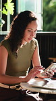 Phone, laptop and woman in cafe with remote work for feedback on creative project with research. Computer, cellphone and editor with email update for online article in coffee shop or restaurant.