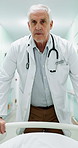 Man, doctor and walk in hospital with stretcher, admission and emergency for urgent surgery. Pov, mature surgeon and transfer in hallway with trolley, critical care and operation room for healthcare
