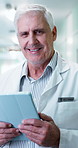 Tablet, man and face of doctor in hospital for research on medical diagnosis or treatment planning. Digital technology, happy and portrait of mature healthcare worker with telehealth on app in clinic