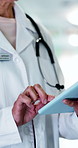 Tablet, research and hands of doctor in hospital for information on medical diagnosis or treatment. Digital technology, woman and mature healthcare worker with telehealth service on app in clinic.