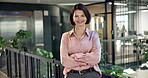 Sustainable, face or woman in office with arms crossed, esg advisor or confidence in eco startup. Happy, portrait or mature csr expert with pride, environmental services or about us in green business