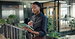 Sustainable, reading or black woman in office with tablet, impact research or review of esg framework. Digital, browse or csr consultant with tech, green strategy report or feedback on eco compliance