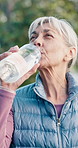 Fitness, drink and old woman in city for rest, workout recovery and hydration with bottle. Exercise break, active retirement and senior person with water for health, beverage and thirsty with runner