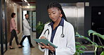 Healthcare, doctor and woman with tablet at clinic lobby, insurance information or case study. Tech, worker and person in hospital for telehealth report, typing schedule or review medical history
