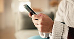 Phone, typing and hands of man in home with texting, email or communication on mobile app. Technology, connectivity and person with cellphone for networking, research or online blog in apartment.