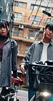 Face, city and Asian couple with bicycle for travel, sightseeing and explore on vacation together. Dating, portrait and man with woman in town for holiday, tourism and break with transport in Japan