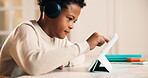 E learning, headphones and child in home with tablet, online class and activity on academic platform. Homework, space and boy in house with tech, digital lesson and homeschool in remote education.