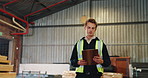 Carpentry, man and walk with clipboard in warehouse for timber audit, quality control or inventory. Carpenter, supervisor and checklist for stock oversight, material inspection and woodworking trade