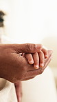 Love, mother and child holding hands in home for safety, parenting and support in living room. Family, mom and kid with bonding together at house for trust, development and guidance or security