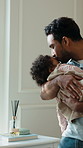 Love, kiss and dad with sleeping baby in home for rest, development support or bonding together. Care, parent and rocking infant child for nap with calm, growth or dream with peace in family house