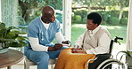 Man, nurse and medication with patient in wheelchair for retirement healthcare or prescription. Caregiver, health worker or talking to female person with a disability for treatment in nursing home