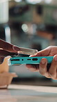 Machine, phone and hands of customer with cashier in cafe with digital payment, card or purchase. Cellphone, people and client with server for POS, checkout or app for loyalty points in restaurant.