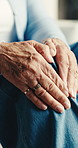 Hands, knee pain and senior woman in home with arthritis, injury or osteoporosis in living room. Recovery, fibromyalgia and elderly person with massage for muscle sprain, gout or inflammation.