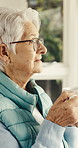 Thinking, coffee and senior woman in home with reflection, memory or reminder of retirement. Remember, warm beverage and elderly person in house with nostalgia, choice or decision on pension.