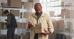 Distribution, typing and man with phone for code with invoice, ecommerce or small business. Parcel, entrepreneur and mature person with tech for logistics, inventory and shipping info or courier app