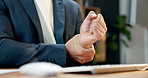 Businessman, hands and wrist pain with injury in office for typing or carpal tunnel syndrome. Man, employee or sore arm with joint inflammation for muscle tension or overworked strain in workplace