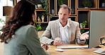 Client, man or consulting at meeting with computer for insurance, risk assessment or policy advice. Advisor, mature people or talk with tech for coverage plan, premium benefits or quote in office