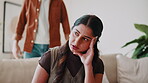 Fight, couple and woman in house with frustration, disagreement and conflict in toxic relationship. Argument, fatigue and people in lounge with issue, tension and partner confrontation in marriage.