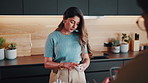 Live streaming, cooking and couple in kitchen for breakfast tutorial on health, wellness or diet blog. Happy, recording and man with woman for preparing cereal together for vlog in apartment.