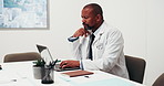 Reading, black man and doctor with laptop in hospital with documents for medical report with planning. Technology, thinking and mature healthcare worker with computer for email feedback on telehealth
