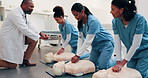 Practice, cpr and doctor with dummy in class for learning first aid, rescue or medical support. Healthcare, help and nurse team with compression technique for cardiac arrest, emergency care or safety