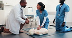 Practice, cpr and doctor with mannequin for students for first aid, rescue and medical support. Healthcare, teaching and people with compression technique for cardiac arrest, emergency care or safety