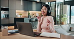 Laptop, headphones and freelancer with woman in home for dance, copywriting success and streaming. Music, online newsletter and audio playlist with person in house for subscription, happy and song