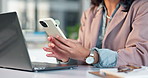 Cellphone, laptop and hands of businesswoman in office with email update on finance report planning. Typing, technology and financial advisor with phone for texting feedback on investment growth.