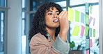 Woman, writing and planning with sticky note in office for business schedule, agenda or tasks. Female person, employee or brainstorming with ideas for project management or reminder in workplace