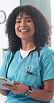 Face, happy woman or nurse with tablet for healthcare, smile or laugh in clinic for wellness service. Portrait, technology and medical worker with research, online report and about us in Brazil