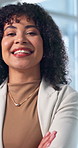 Arms crossed, confident and face of business woman in office for corporate or finance career. About us, friendly and smile of happy employee in financial workplace for investment or risk management
