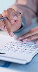 Hands, business and woman in office with calculator, expenses and documents for finance records. Person, calculating and writing in workplace with paperwork, monthly revenue and invoice for cash flow