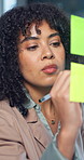 Sticky note, planning and woman writing in office for financial strategy, mind map or schedule. Glass wall, person and brainstorming business idea for investment objectives, agenda or problem solving