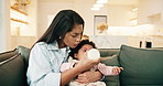 Mom, baby or drinking with bottle in home for parenthood, feeding or comfort for soothing. Mother, child or infant crying with milk, hunger or discomfort for reflux, indigestion or parenting in house