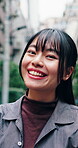 Tourist, face and Asian woman in town with laugh, good mood and weekend unwind in outdoor travel. Portrait, humor and person in city with confidence, happy moment and holiday sightseeing on day off.