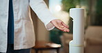 Dispenser, spray and doctor with hand sanitizer in clinic for hygiene, disinfection and germ prevention. Healthcare, hospital and person with liquid for bacteria, protection and wellness for health
