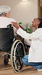 Conversation, nurse and old woman in wheelchair for consulting, healthcare or rehabilitation. Caregiver, happy and senior person with disability in retirement home for medical feedback or support