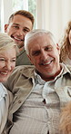 Big family, face and smile on sofa with dog, support and bonding in living room of home to relax. Pet animal, senior parents and adult people with happy, portrait and laughing for relationship