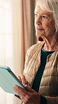 Senior, woman and thinking with tablet in home for ebook insight, web novel and download choice. Digital library, old person and tech at window for chapter release or subscription option for sign up