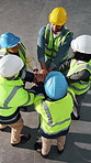 Above, celebration and engineer with hands together in warehouse for construction, motivation or success. People, team and contractors piling with applause for winning, meeting or unity in depot