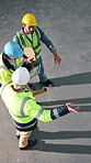 Construction, team and above of people with tablet for planning, building update and meeting. Walking, warehouse and men with tech, blueprint and talking for renovation, remodeling and architecture