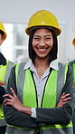 Construction, face and woman with team in building for collaboration, renovation or leadership. Architecture, portrait and people with crossed arms for remodeling, property development or engineering