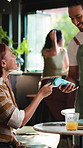 Woman, credit card and waiter with pos machine at cafe, order and customer experience at diner. People, server and smile for easy payment at coffee shop, fintech or checkout with thanks at restaurant