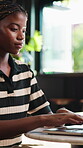 Remote work, online and woman with laptop in cafe, copywriting and typing article on website or info. Happy, freelancer and black person with tech, email marketing and planning for blog post in shop
