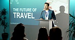 Business, man and speaker at seminar with mic, speech and coaching event for future of travel. Person, presenter and audience at conference for presentation, tourism innovation and ai transportation
