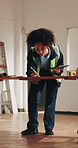 Contractor, tablet and drawing for construction site, blueprint inspection or renovation assessment. Woman, tech and online checklist for remodeling, floor plan and notes for property development