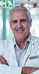 Face, man and doctor with confidence, medical experience and arms crossed with smile in hospital. Happy, healthcare physician and mature person in clinic, about us or portrait of general practitioner