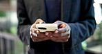 Typing, online and hands with phone in office, texting or communication with contact on social media. Business, message and person with mobile, internet search and network with technology and chat
