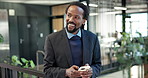 Thinking, online and happy man with phone in business, texting or chat with contact on social media. Typing, message and black person with mobile, internet search and networking with tech in office